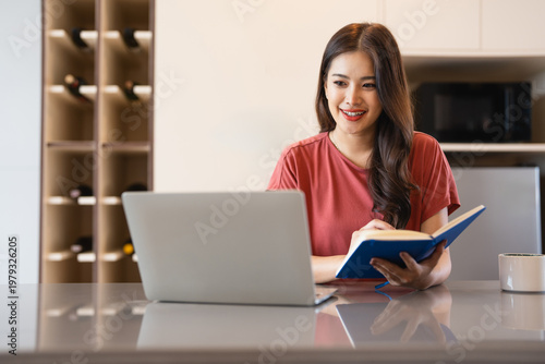 Happy thoughtful remote employee, working at laptop form home, looking at window away, thinking over workday tasks. Student making notes at kitchen table, sitting at computer in deep thoughts. Free Download Happy thoughtful remote employee, working at laptop form home, looking at window away, thinking over workday tasks. Student making notes at kitchen table, sitting at computer in deep thoughts. - GFXLoad