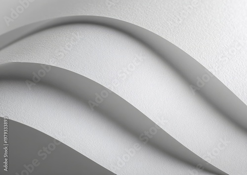 Abstract, flowing white paper curves create a sense of motion and light