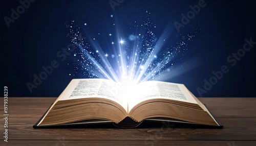 An open book, set on wood, radiates brilliant, heavenly light. Sparkling particles erupt from the pages against a dark, blue backdrop