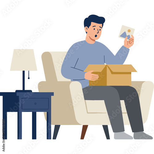 Man sitting on couch opens box with surprise and holds paper