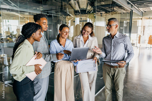 Development team reviews demonstration while smiling and planning features