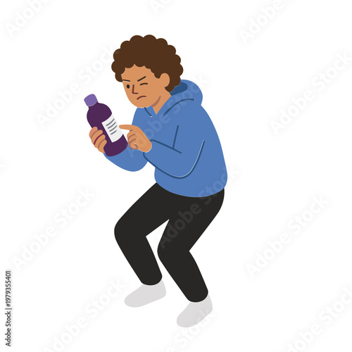 A young man is happily dancing while holding a bottle and reading its label.