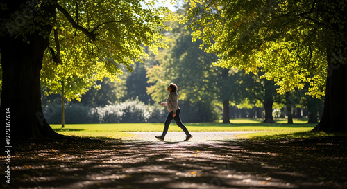 Serene Stroll: A solitary individual enjoys a peaceful walk along a tree-lined path, sunlight dappling through the leaves, creating a sense of tranquility.