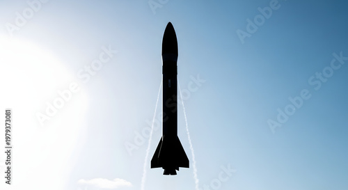 Soaring Silhouette: A majestic rocket ascends into the expansive sky, its form a powerful symbol of human innovation and aspiration.