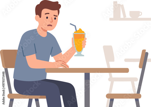 Man sitting at table holding orange drink with straw in cafe