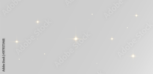 Fotografie Realistic golden sparkling stars with soft twinkling light effects for festive d