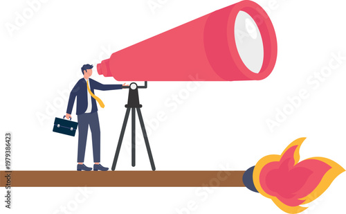 Professional looking through telescope at fire