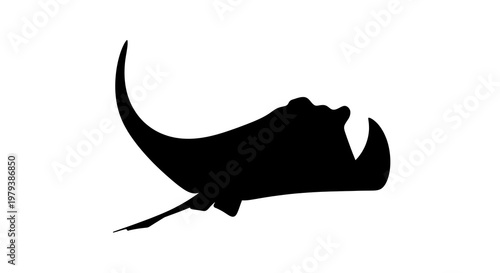 Black silhouette of a stingray swimming.