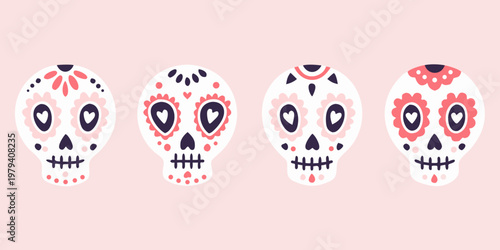 Four colorful sugar skulls displayed on a light pink background