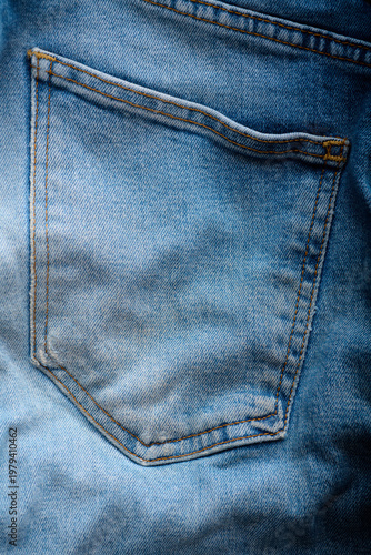 Close-up of the back pocket of an old pair of jeans.