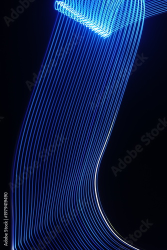 Electric blue light trails against a deep black background