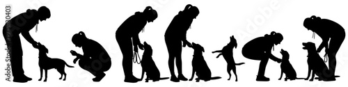Set of black silhouettes showing a woman training and playing with her dog in various poses on white background