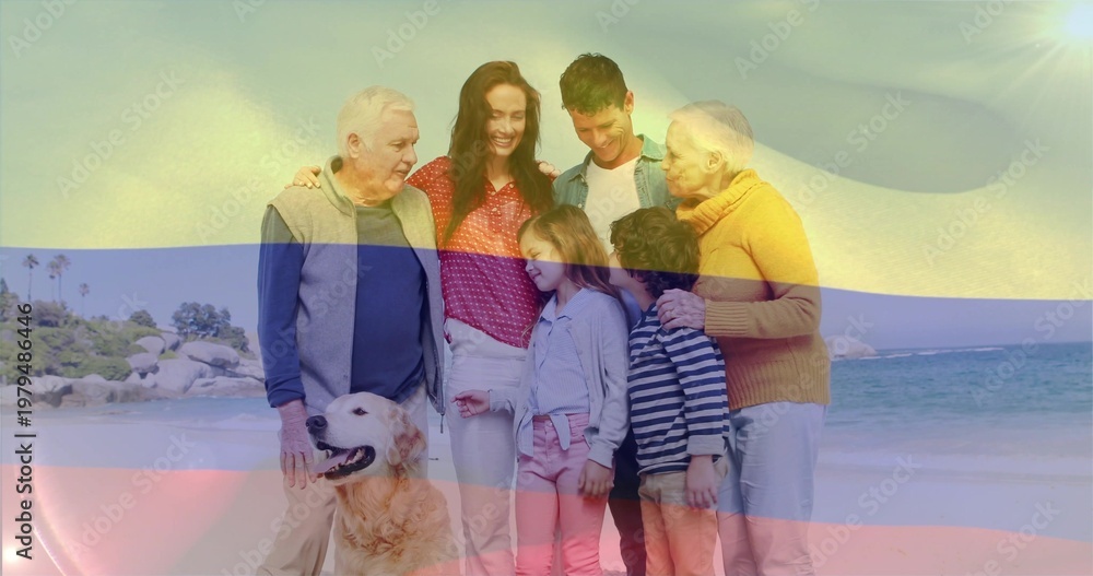 Obraz premium Standing three-gen family posing on beach in casual clothes, golden retriever panting, color bands