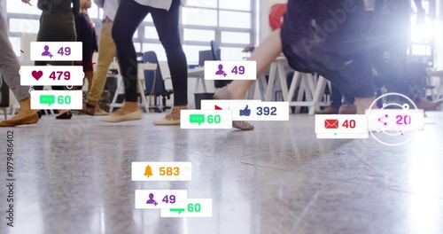 Walking group legs crossing polished floor in bright meeting, showing jeans and notification badges