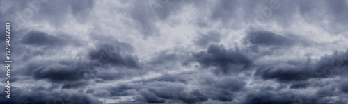 Dark cloudy sky before thunderstorm. Storm clouds. Gloomy heaven cloudscape wide panorama. Nature dramatic skyscape panoramic background