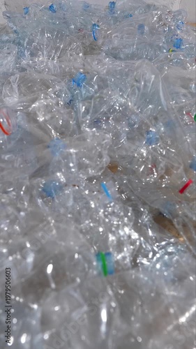 Crushed plastic bottles for recycling waste management and sustainability concept