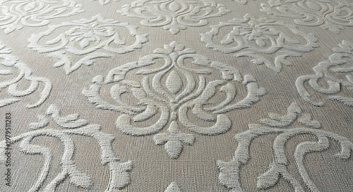 A close-up view of a textured fabric with an intricate floral pattern
