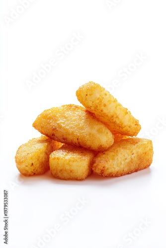 Crispy golden potato hash brown sticks piled up against a clean white background