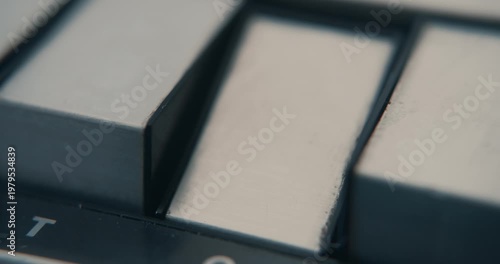 Pushing the stop button of a vintage tape recorder