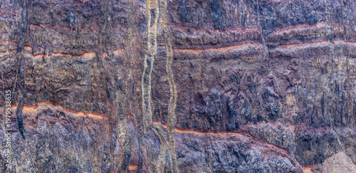 Steep cliff on the volcanic peninsula of Ponta de São Lourenço at the east-coast of the isle of Madeira; close-up of layers of lava and volcanic ash, Madeira Portugal