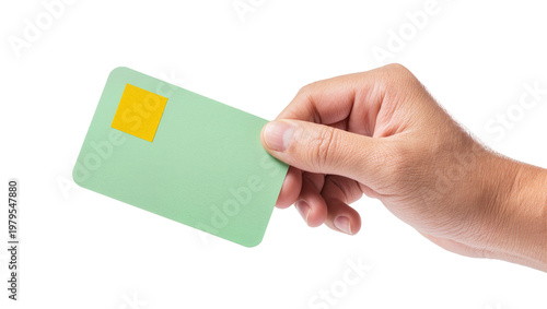 Green plastic card held by human hand with yellow square sticker