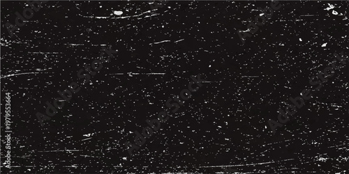 A captivating, dramatic close-up showcases a rich black surface adorned with subtle, textured scratches, evoking a sense of depth and mystery.