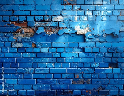 Textured close-up shot of a weathered brick wall painted in shades of blue. Sections of paint are peeling away