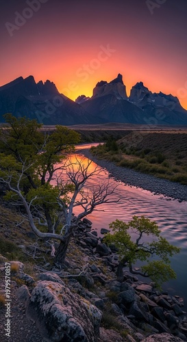 Sunset over the mountains reflecting on the river landscape.