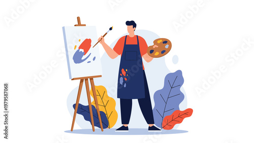 Creative male artist wearing blue apron painting colorful abstract work on canvas while holding wooden palette and brush.
