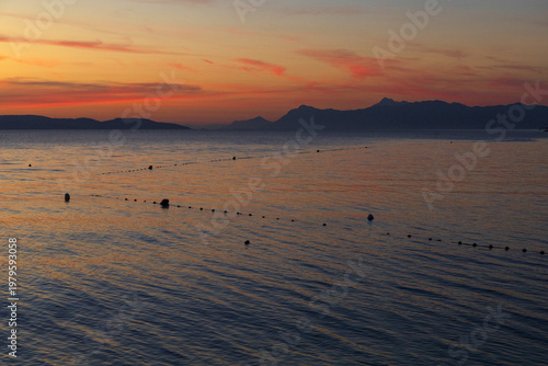 Sunset over Adriatic sea with mussel farming nets Croatia