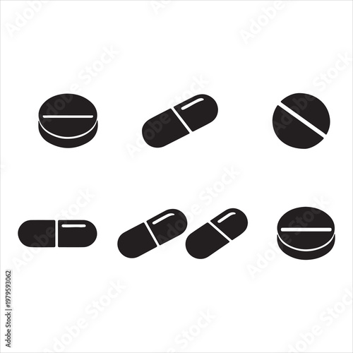 A collection of black pills and capsules on a white background