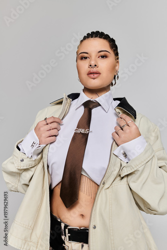 Stylish young woman exudes confidence in a trendy outfit for a fashion shoot indoors