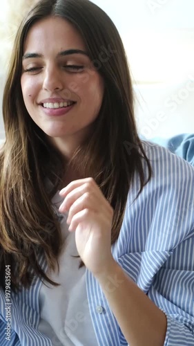 Happy Young Woman Laughing And Smiling Joyfully In A Relaxed Home Environment