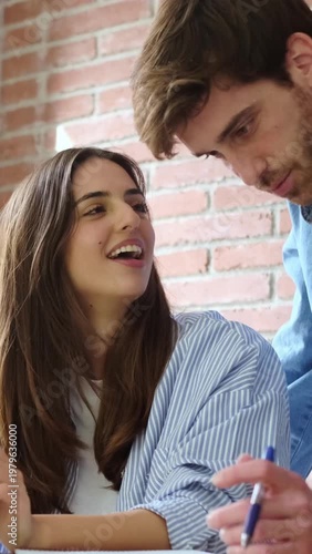 Young People Collaborating on a Project, Sharing Ideas and Learning with Pen and Paper