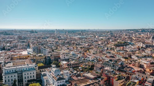 Drone Hyperlapse Over Rome Featuring Historic Domes, Dense Mediterranean Residential Terracotta Rooftops and the Tiber River Crossing the Eternal City in Old Town Area. Beautiful Italian Architecture.