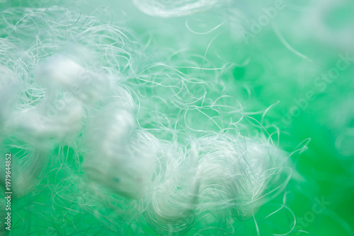 Quadro su tela Extreme macro of polyester stable fiber on green background