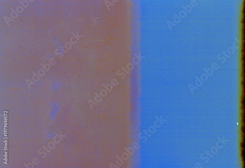 Blank grained film strip texture background with heavy grain, dust and light leak