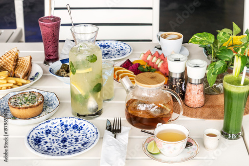 mixed western healthy food meal on restaurant table outdoors in singapore restaurant