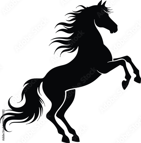 Powerful black stallion horse rearing up silhouette.