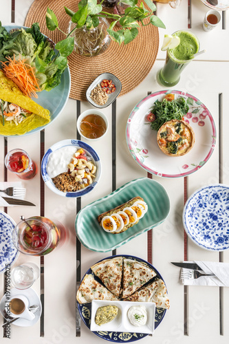mixed western healthy food meal on restaurant table outdoors in singapore restaurant