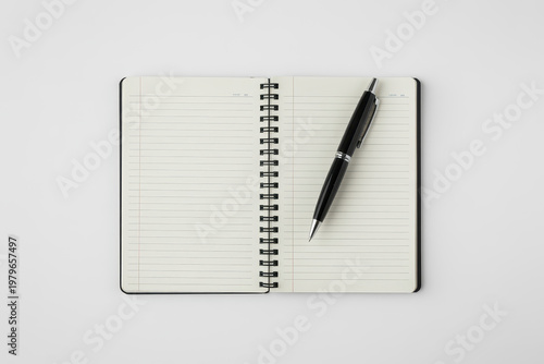 Spiral Notebook With Pen On White Background For Writing And Office Concepts