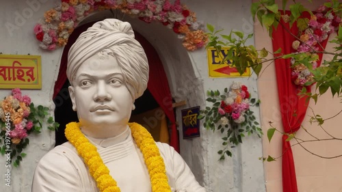 Statue of Swami Vivekananda placed inside a home in India, showing spiritual inspiration, calm presence and cultural significance in indoor setting.