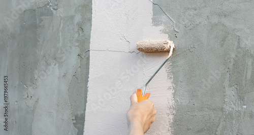 Wallpaper Mural Hand rolls paint across rough concrete surface Torontodigital.ca