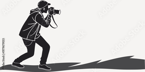 Action silhouette of a photographer in a hoodie and cap carrying a camera and taking pictures graphic design illustration with photographer silhouette photography shooting movement isolated