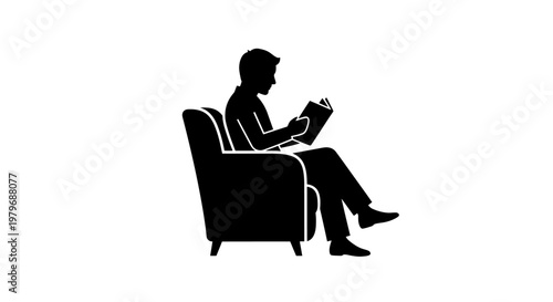 Man sitting on chair reading book.