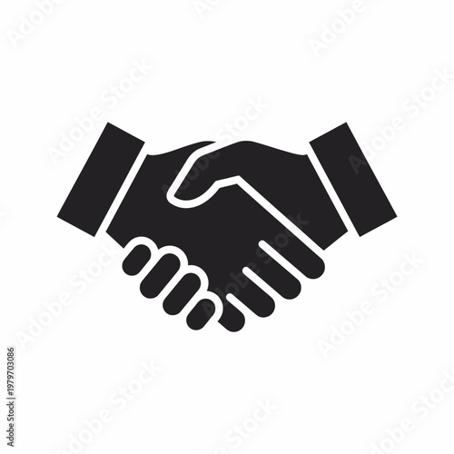 Business partners seal a deal with a firm handshake 