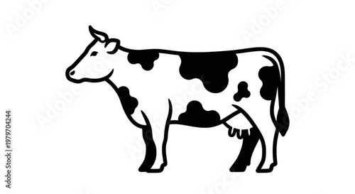 Black and white Holstein Friesian cow standing in profile, a breed known for dairy production and distinctive spotted coat pattern