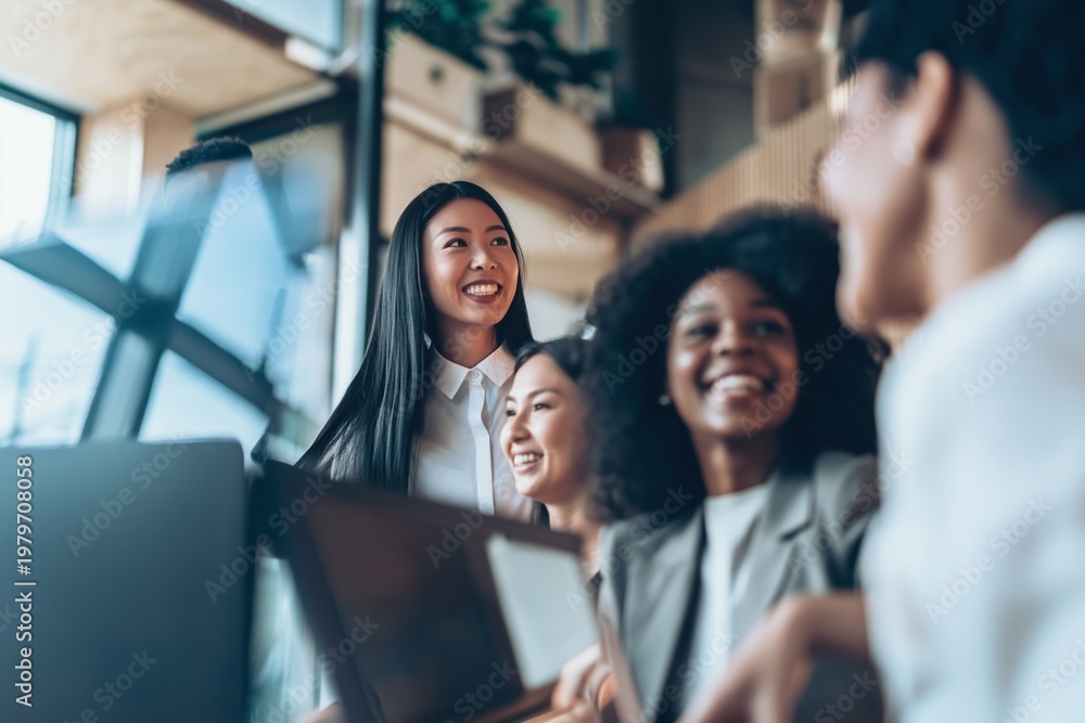 Obraz premium Diverse coworkers smiling together showing teamwork collaboration and positive modern workplace environment indoors