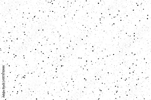 A minimalist arrangement of tiny black ink dots and splatters randomly dispersed across a bright white surface