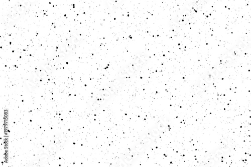 Photos Scattered tiny black dots create a subtle textured pattern on a bright white sur